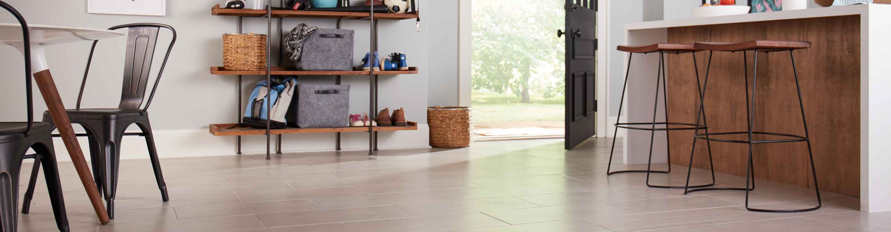 wood look tile in modern kitchen with kitchen table, counter, bar stools and wood entryway shelving